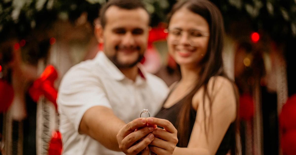A newly engaged couple celebrating