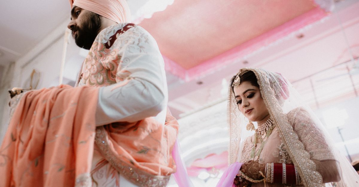 A couple during the Anand Karaj ceremony at a Gurdwara