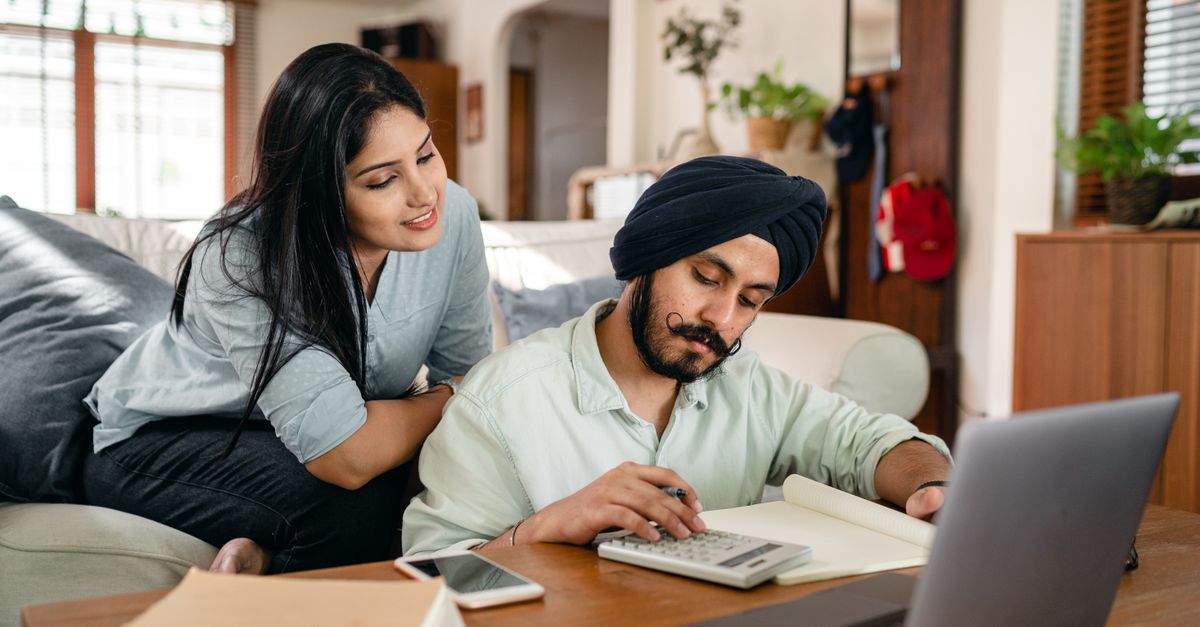 A couple reviewing wedding costs together
