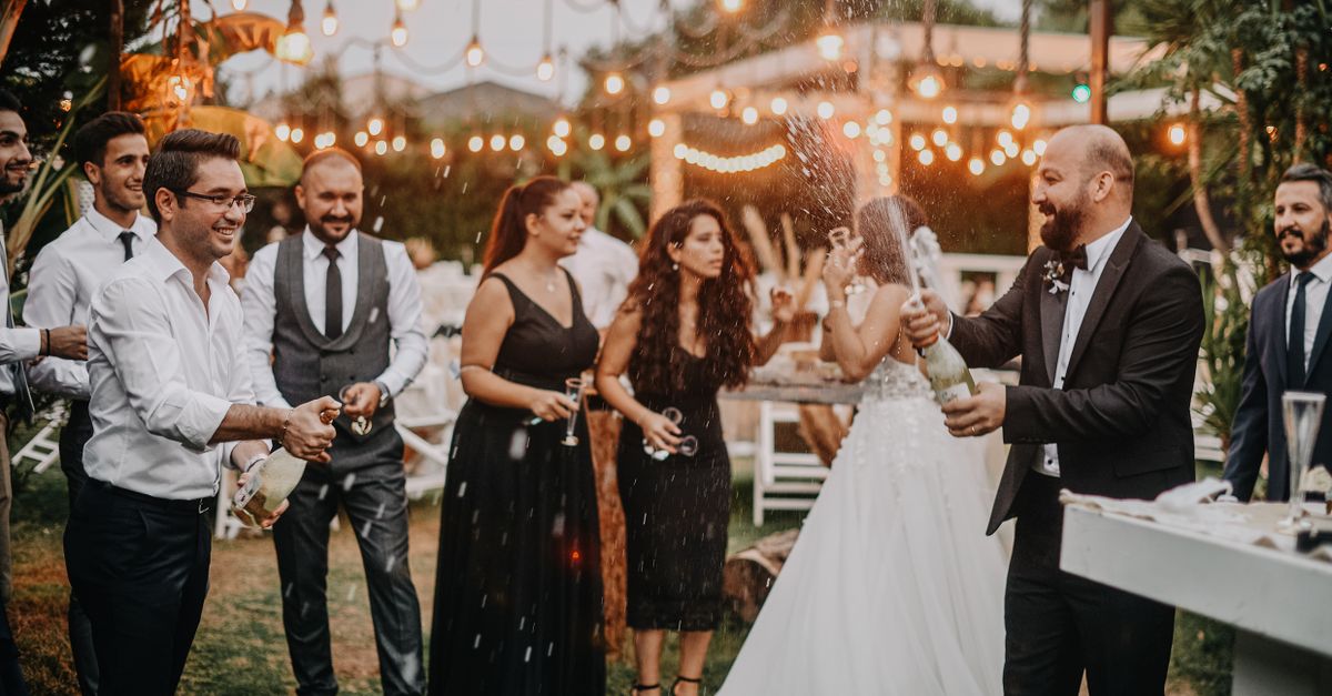 Guests raising a toast at a wedding drinks reception